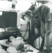 Dr. Graham examines a baby at Institute of Pediatrics.
