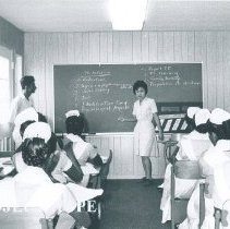 Sato Hashizume with her counterpart giving a class on the SS HOPE in Ceylon