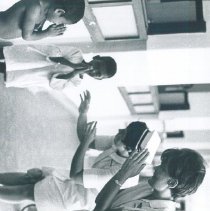 Maureen Gallaher and Inge Hansen with patients on the SS HOPE in Ceylon.