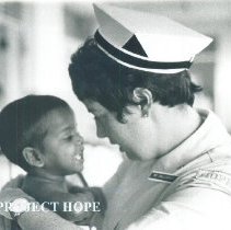 Maureen Gallagher Dever with patient on the SS HOPE in Ceylon.