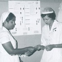 Pat Anderson with counterpart on the SS HOPE in Ceylon.