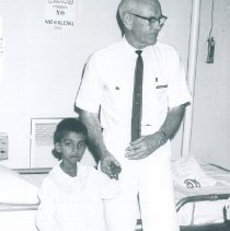 Dr Barnes with patient on the SS HOPE in Ceylon.