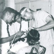 Philip Fleuchaus in the dental clinic on the SS HOPE in Ceylon.