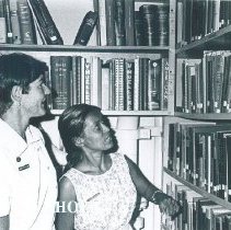 Harriet Weller assists a nurse in the library on the SS HOPE in Ceylon.