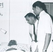 Charles Geraci with counterpart on the SS HOPE in Ceylon.