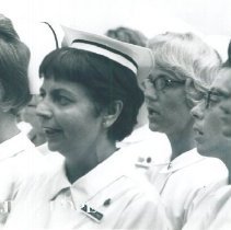 Dorothy Aeschliman singing with nurses on the SS HOPE in Ceylon.