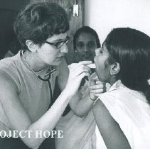 Sara Ann Cuene with a patient  with the SS HOPE in Ceylon.