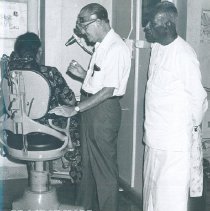 Unknown doctor with patient on the SS HOPE in Ceylon.