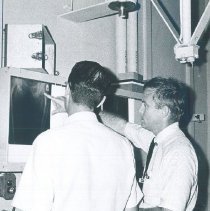 Unknown doctor with counterpart on the SS HOPE in Ceylon.