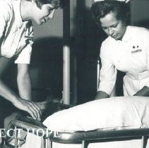 Carol Curry and Rosanna Schmitt on the SS HOPE in Ceylon.