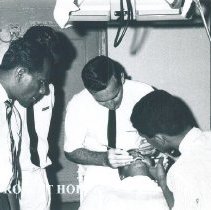 Paul Sommer and counterparts in Dental Clinic on the SS HOPE in Ceylon.