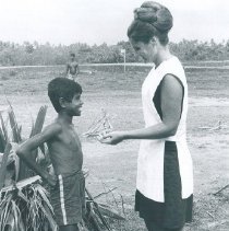 Sylvia Lawrence with a young Ceylonese boy in Ceylon.