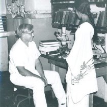 Unknown with Ceylonese counterpart on the SS HOPE in Ceylon.