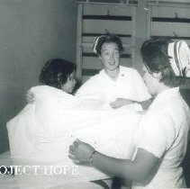 Pat Sweet with patient and counterpart in Turjillo, Peru.