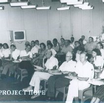 William B Walsh (arms folded) in lecture on the SS HOPE in Saigon, Viet Nam