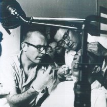 An unknown HOPE Dentist with counterpart on the SS HOPE in Saigon, Viet Nam