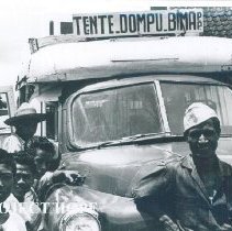 Buses carry patients and staff to the docks when the SS HOPE in Indonesia.