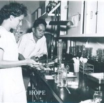Mary Jo Ann Crary with counterpart in laboratory on SS HOPE Indonesia. 1960