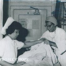 Marianne Rawack Brannon with counterpart on SS HOPE in Saigon, Vietnam.