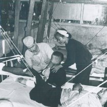 Unknown doctor with patient in a clinic in Vietnam 1960.
