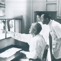 SS HOPE John Adams with counterpart at Bihn Dan Hospital in  Vietnam 1960