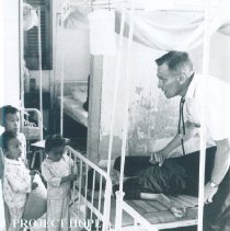 SS HOPE George Brockman with patient at Tan An Hospital in Vietnam 1960