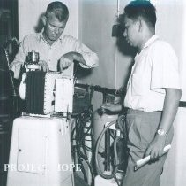 Leo Haney repairs equipment on SS HOPE in Indonesia 1960.