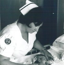 HOPE nurse Mary Payne with Pediatric patient in Mercy Hospital.