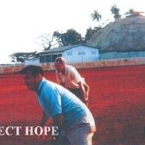 William B Walsh and Ambassador Loeb playing baseball in Guinea 1964.