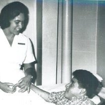 Unknown HOPE nurse with patient on the SSHOPE in Guayaquil,Ecuador 1963.