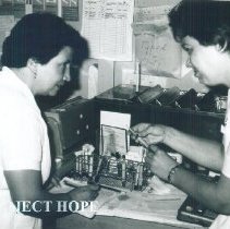 Unknown Med Tech with counterpart on the SS HOPE in Quayaquil, Ecuador 1963