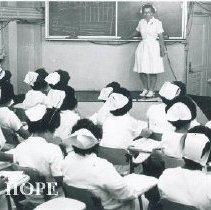 Elizabeth Berry in lecture room on the SS HOPE in Guayaquil Ecuador 1963.