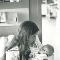 Project HOPE nurse with premature Polish infant.