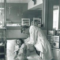 Dr William Norwood Project HOPE physician examines patient in Krakow, Polan