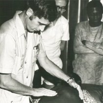 Project HOPE Dr Robert Brown with patient in Nigeria