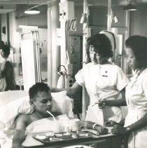 Grace Daniels and counterpart with a spinal cord injury patient on the SS H