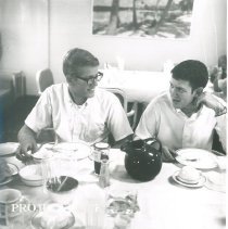 William B Walsh, Jr in the SS HOPE dining room with a HOPE doctor.