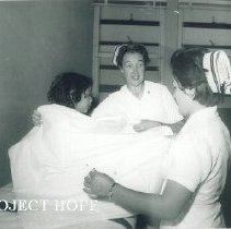 HOPE nurses unknown with Peruvian patient on SSHOPE in Peru 1962.
