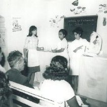 HOPE nurse unknown with Peruvians in Peru in 1962.