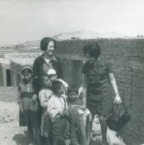 HOPE nurse unknown with counterpart and children in Peru in 1962.