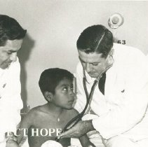 William B Walsh with patient on SSHOPE in Peru in 1962.