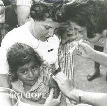 HOPE nurse Madaleine Schopfer & counterpart giving vaccinations in Peru in