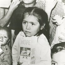 Peruvian child with carton of milk from the SSHOPE while in Peru in 1962.