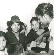 HOPE PT Vivian Crosswhite giving milk from the SSHOPE in Peru in 1962.