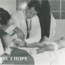 HOPE doctor unknown and counterpart with patient on SSHOPE in Peru 1962.