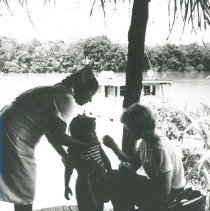 HOPE nurse unknown and counterpart immunizing along Amazon in Peru.