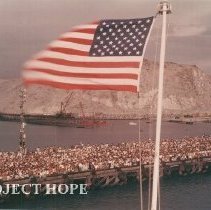 SSHOPE departure with American flag in foreground in Peru in 1962