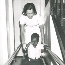 HOPE PT Carol Blomgren with patient on SS HOPE in Colombia in 1967.