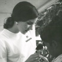 Nan Baptisti giving immunizations in Colombia while SS HOPE was there 1967.