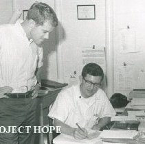 Bill Peters and unknown on SS HOPE in Colombia in 1967.